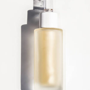 Bottle with a dropper and yellow liquid. serum for the face