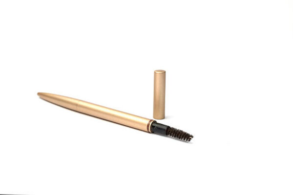 Eyelash brush on white background